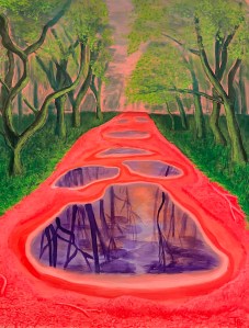 Reflections of trees in puddles along a pathway, with pinkish soil and green tree trunks.